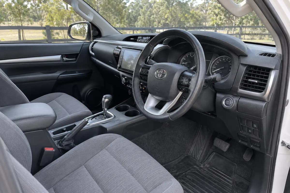 HiLux cabin with cloth seats and dashboard